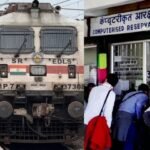 Indian Railways ticket booking counter with a passenger making a digital payment for travel insurance. Indian railway